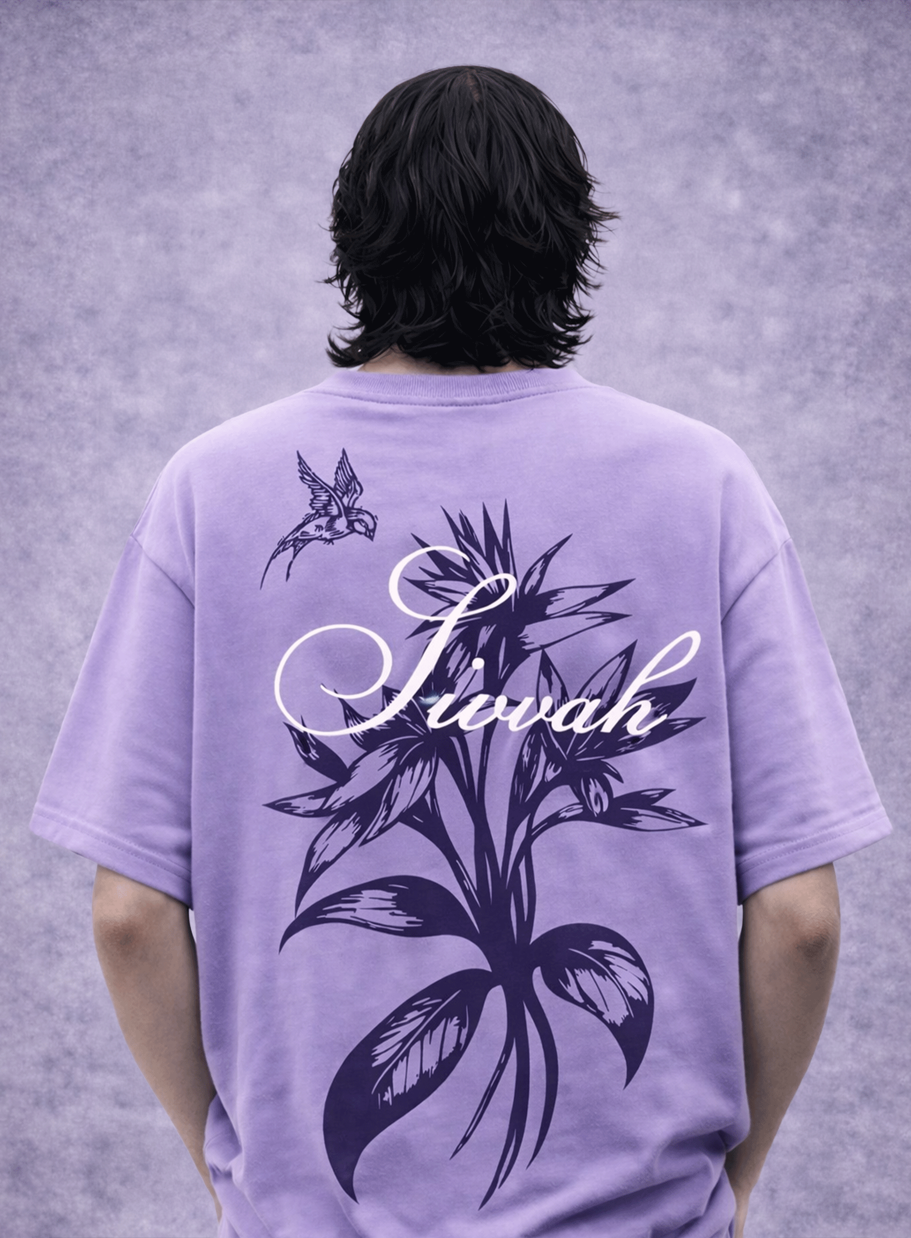Person wearing a purple t-shirt with floral design and 'Sivah' text on the back against a gray background