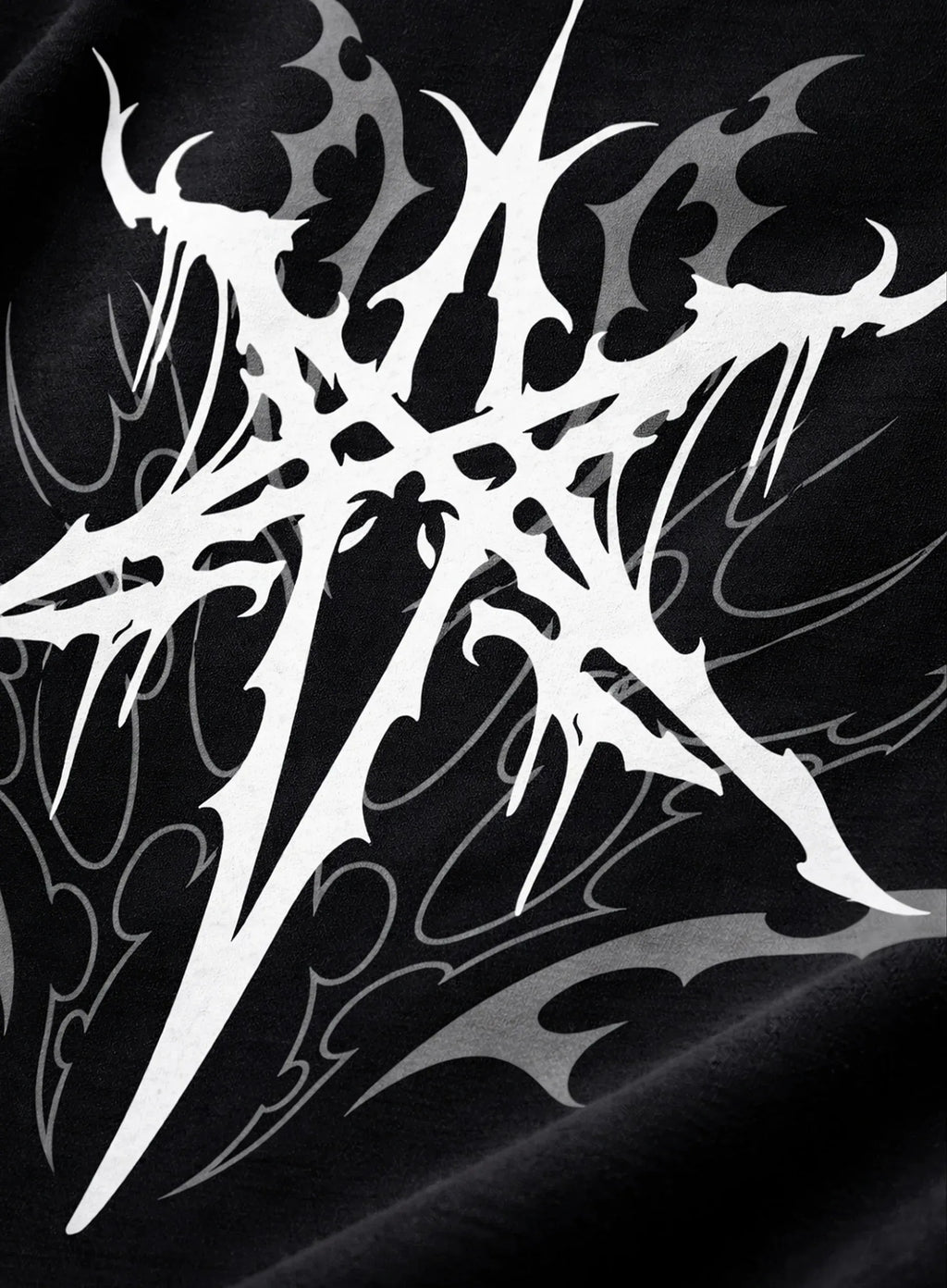 White tribal design on a black shirt