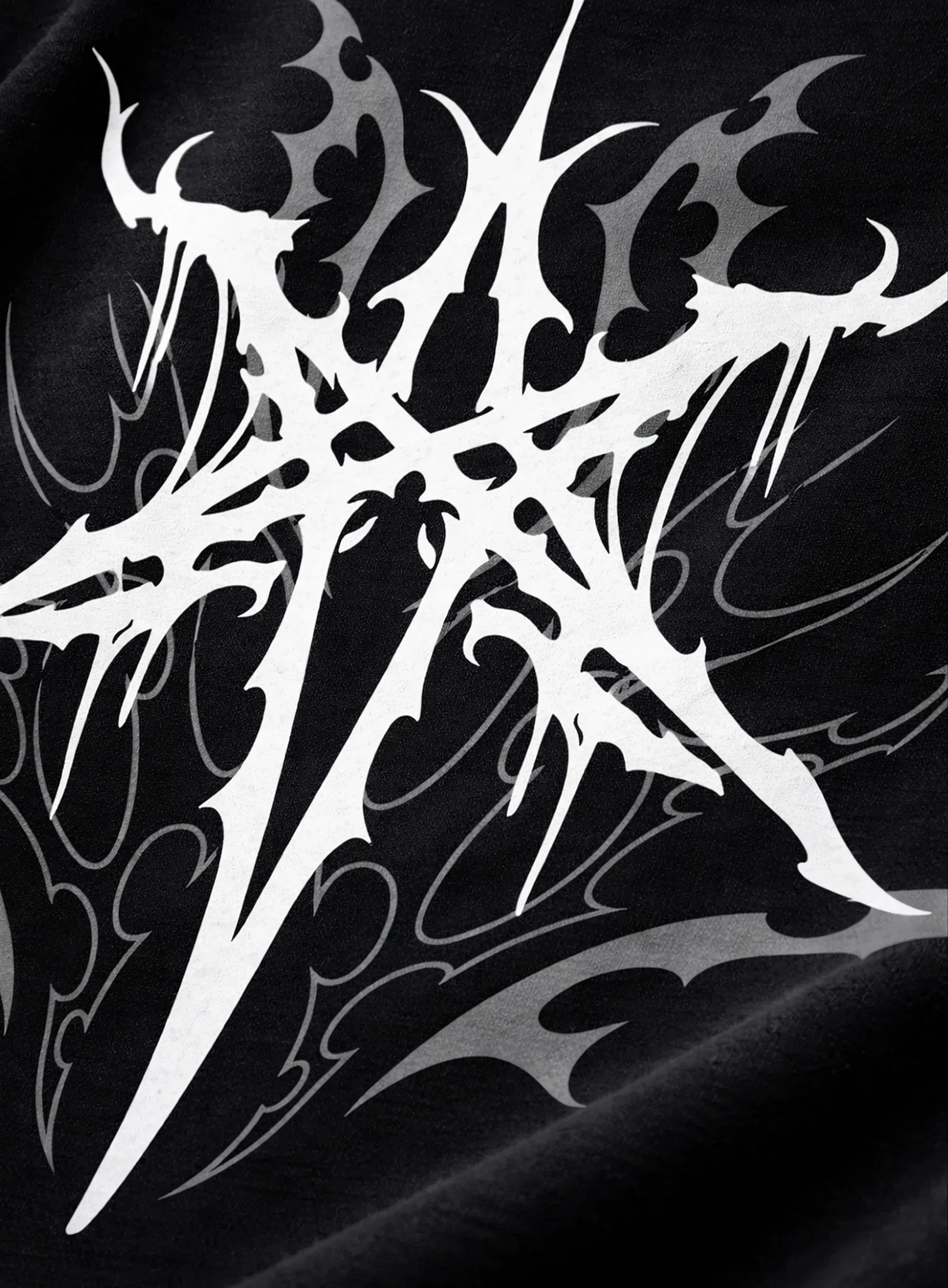 White tribal design on a black shirt