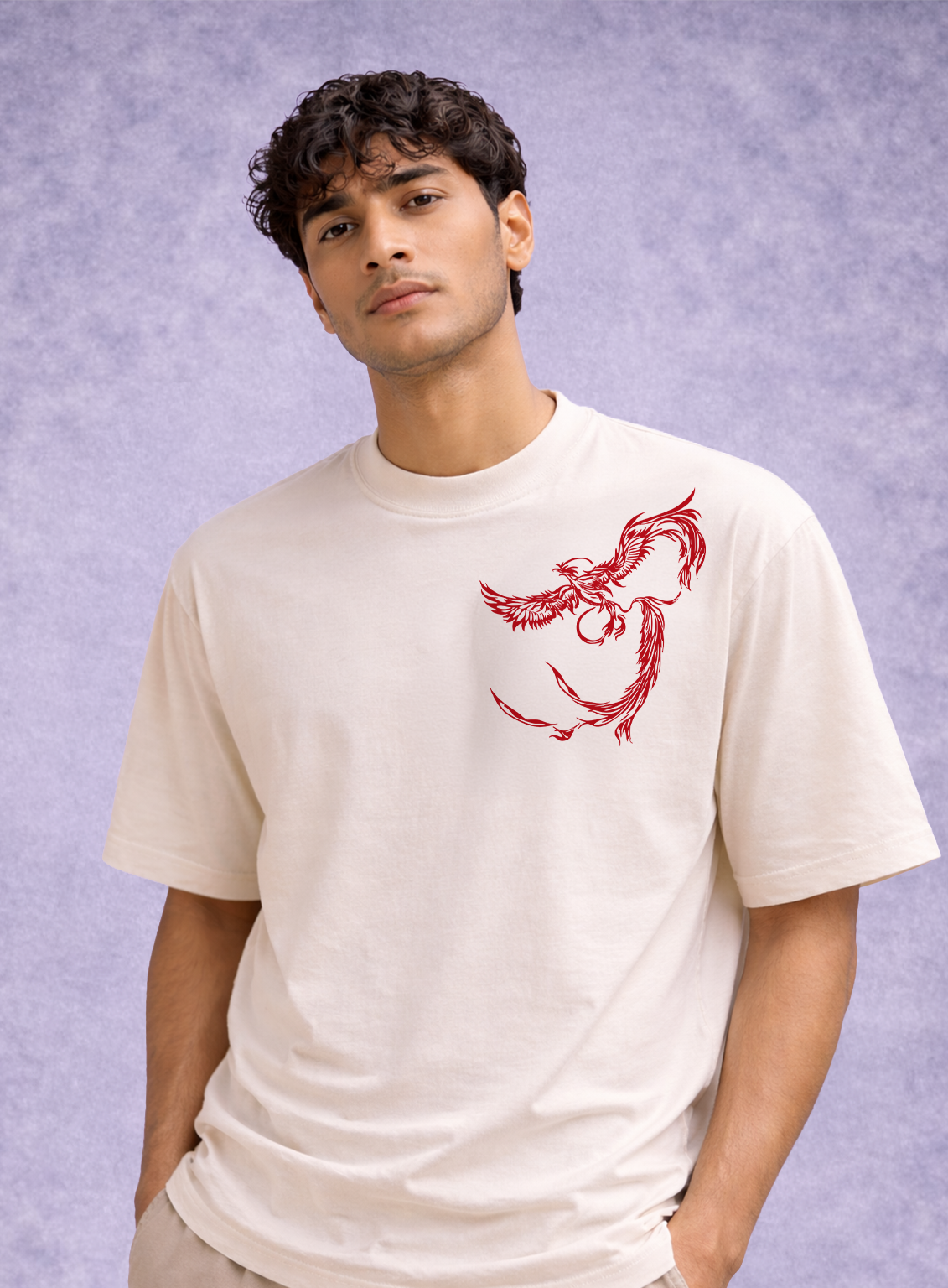 Man wearing a white t-shirt with a red graphic design on a light purple background