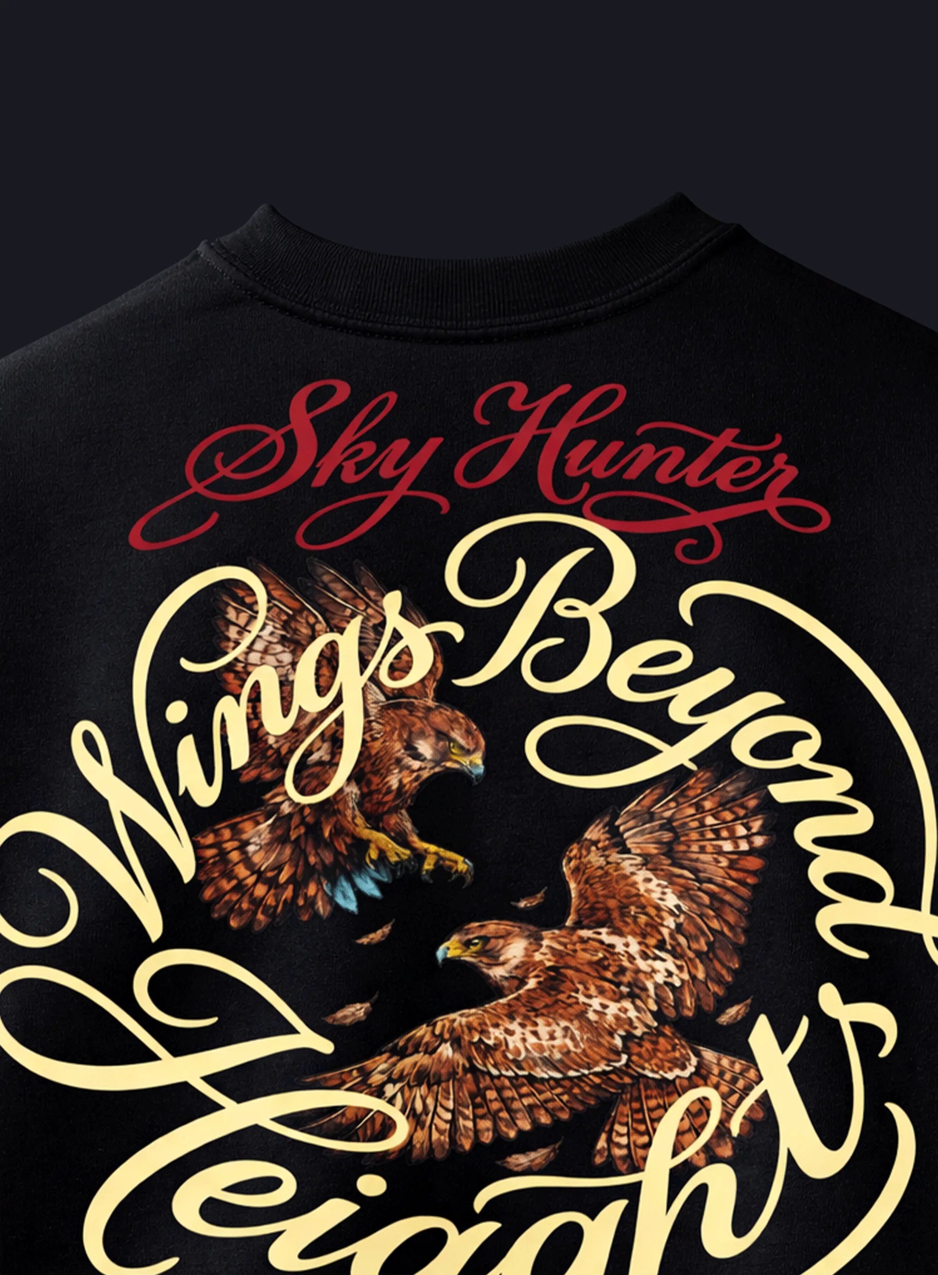 Black t-shirt with 'Sky Hunter Wings Beyond Heights' text and eagle graphics on a dark background