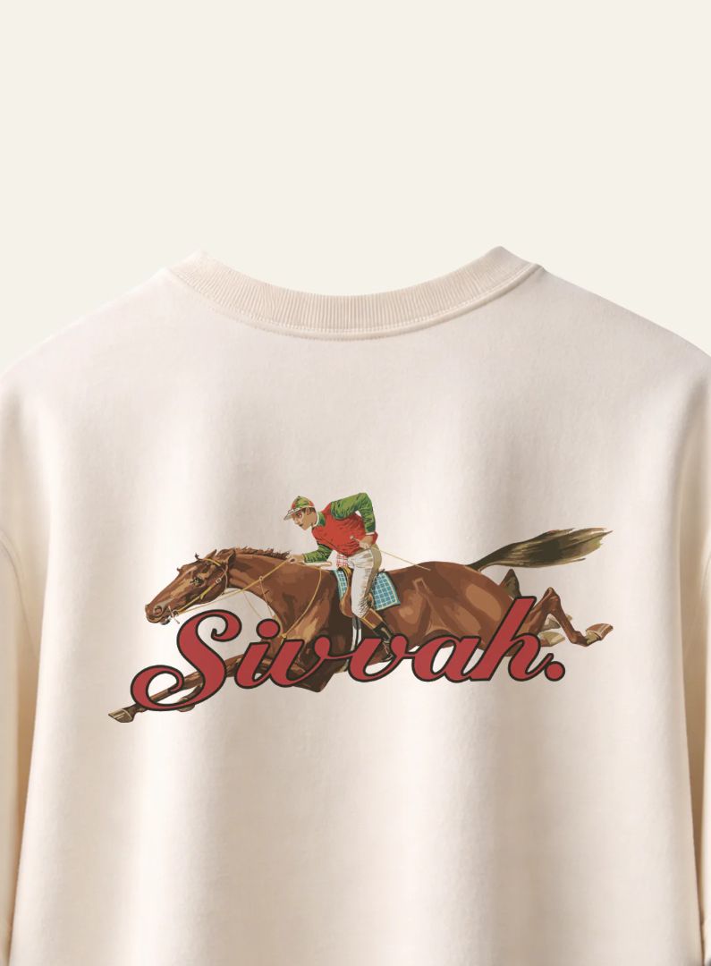 Beige sweatshirt with a graphic of a jockey on a horse and the word 'Sirvah'.